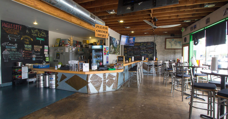 Interior, bar area with chalkboard menu on the wall