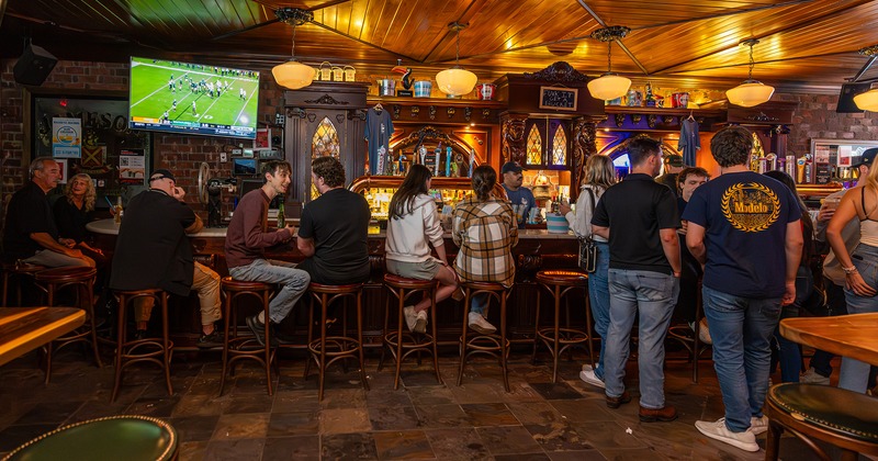 Interior, bar area full of guests