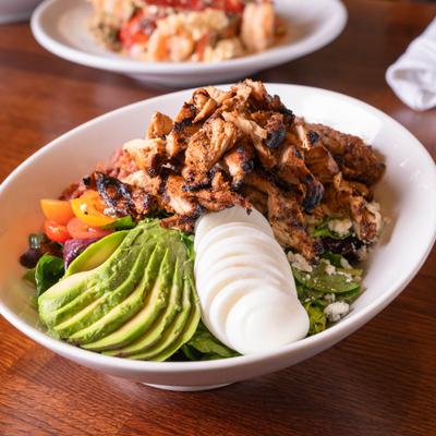 Cobb salad with grilled chicken breast.