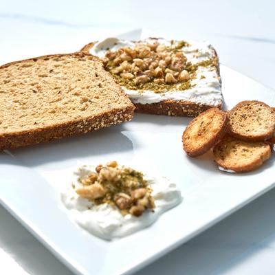 Sandwich with creamy spread, and nuts.