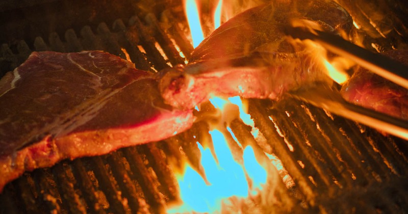 Cooking steak on the grill, closeup