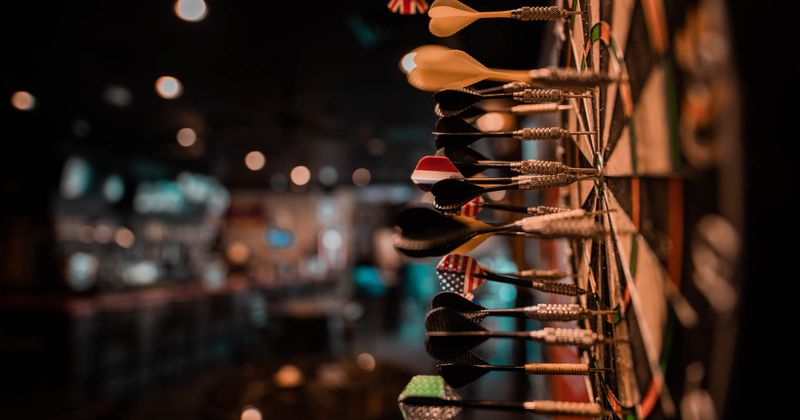 A dartboard with darts closeup