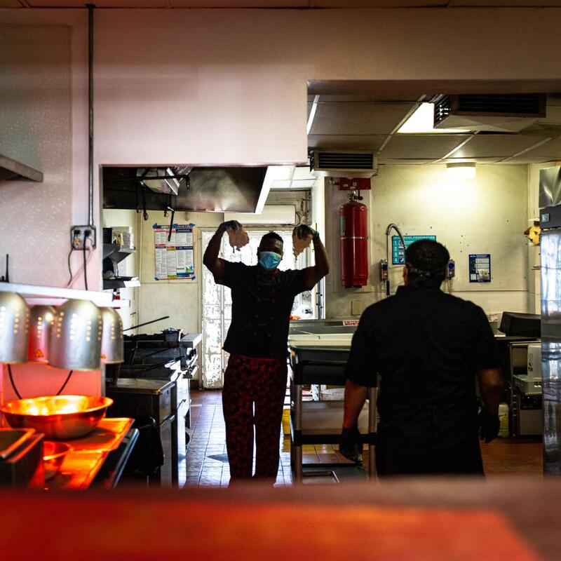 Interior, kitchen staff with sanitary masks