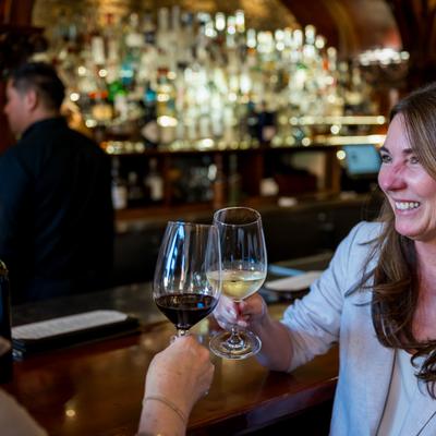 People toasting with their drinks.