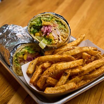 The Phat Wrap with a side of fries.