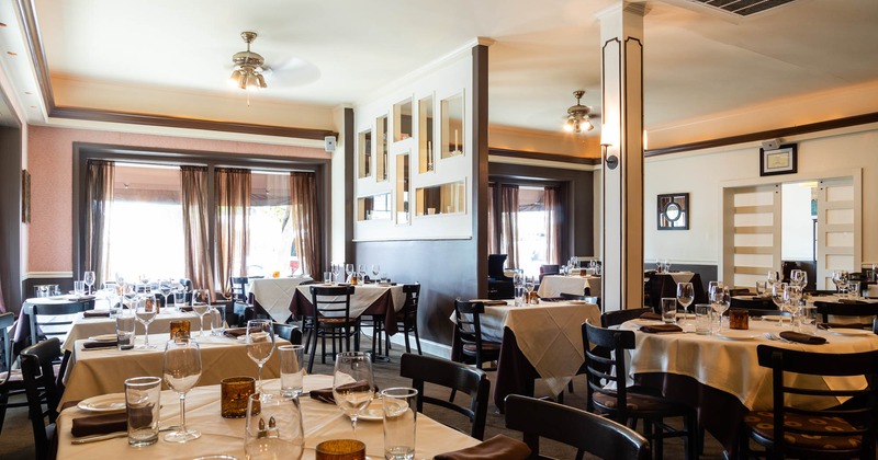 Interior, seating area with numerous tables