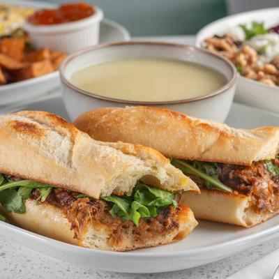 Slow-cooked pork sandwiches and other food.