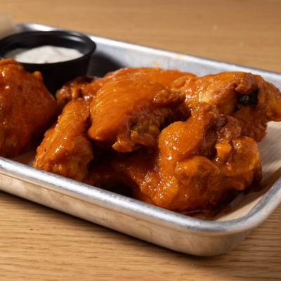 Buffalo wings with blue cheese dip.