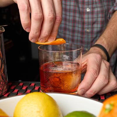 Hands serving up a drink.