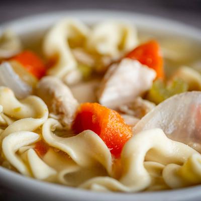 Chicken noodle soup, close view.