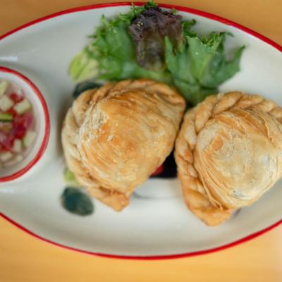 Puff pastry filled with chicken, potato, and onion seasoned with Thai curry.