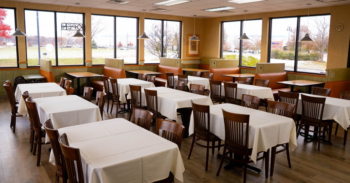 Interior seating area with chairs, tables and double booths