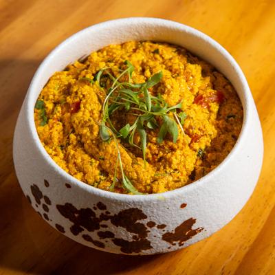 Paneer bhurji served in the white bowl.
