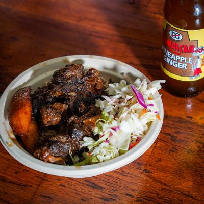 Oxtail Rice Bowl beside a Jamaican pineapple ginger drink.