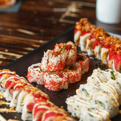 Sushi platter with assorted sushi rolls.