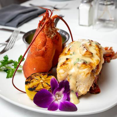 Broiled lobster tail, melted butter and lemon butter sauce