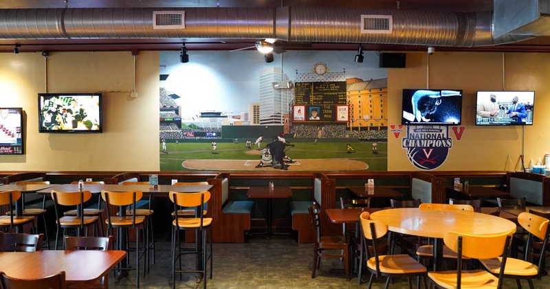 Interior, tables ready for guests, picture on the wall
