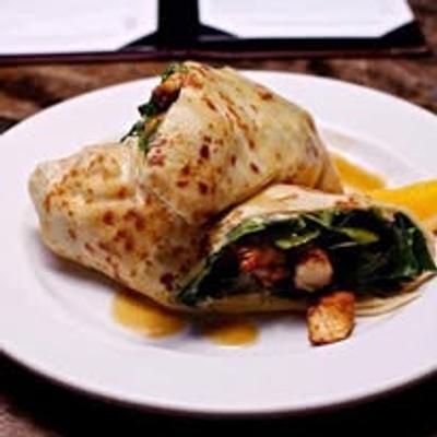 Folded crepe with spinach and grilled chicken.