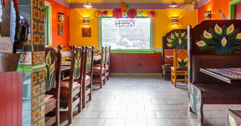 Interior, dining area, seating booths with tables, regular tables, Mexican motif decoration