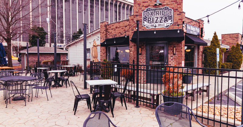 Exterior, patio with tables, chairs and parasols