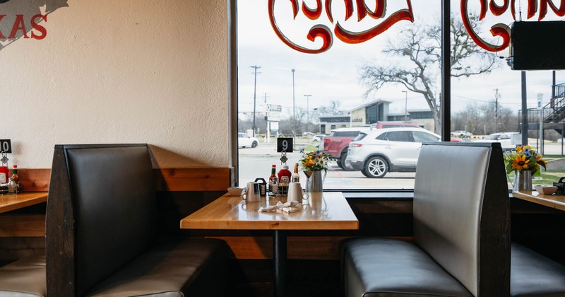 Interior, seating booths with tables, ready for guests, shop window