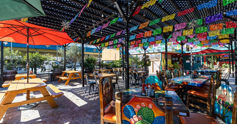 Exterior, patio shadow, decorated tables and chairs, benches, parasols