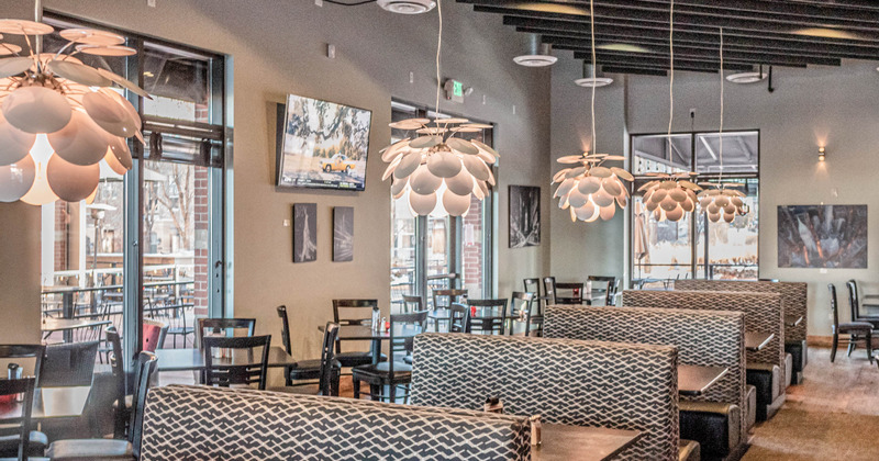 Interior, tables for four ready for guests