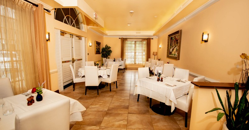 Interior, dining area with tables ready for guests