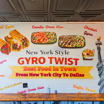 Wall mural featuring the Statue of Liberty and images of various dishes.