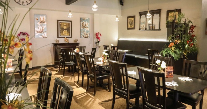 Interior seating area ready for guests, floral decoration