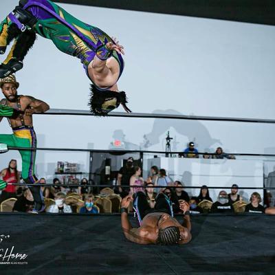 Wrestlers entertaining the audience.