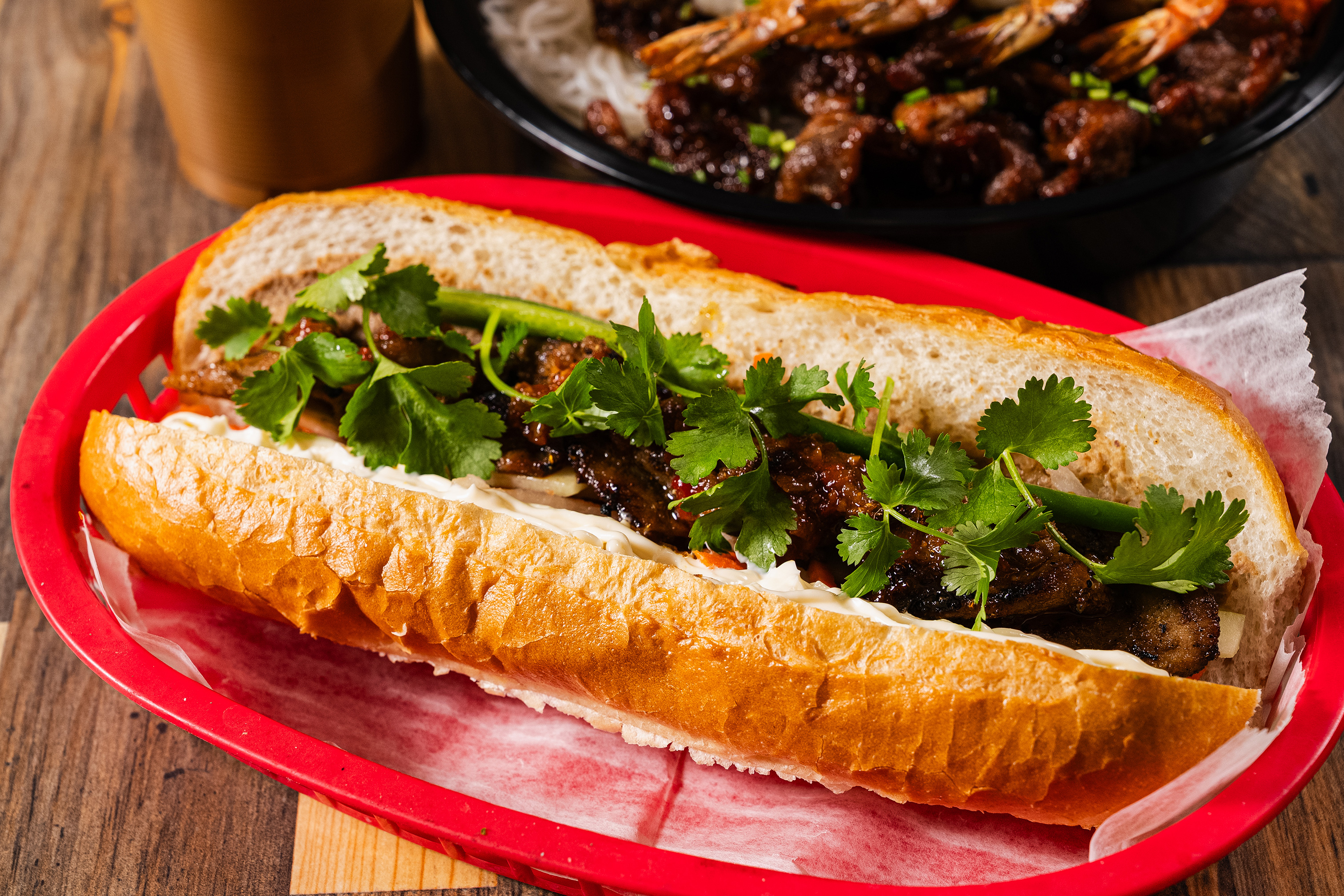 Banh Mi sandwich with barbeque pork toipped with fresh cilantro