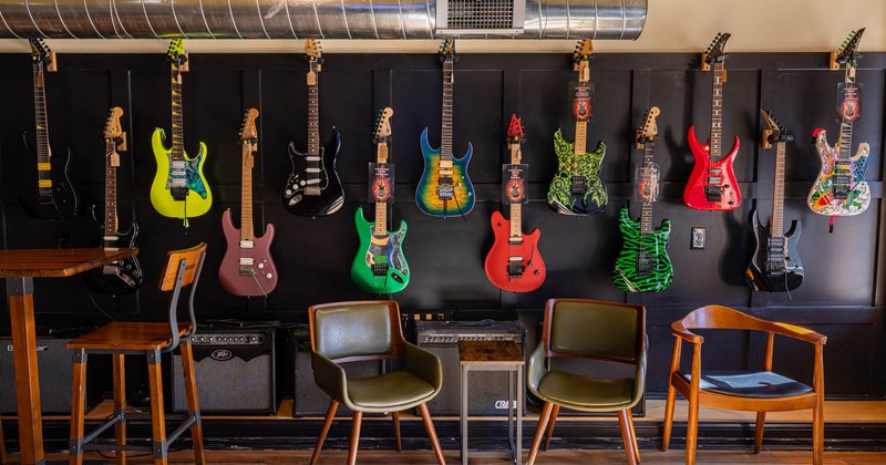 Inside, seating area with guitars on the wall