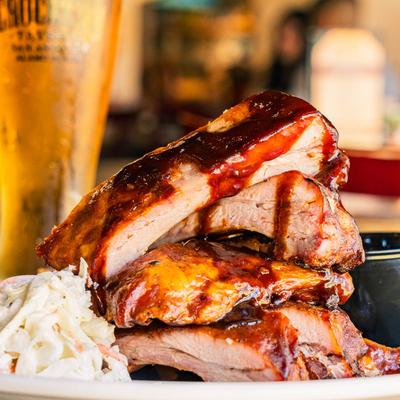 Baby back ribs stacked with barbecue glaze.