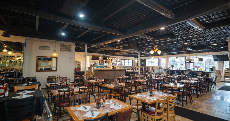 Interior space, dining area with set dining tables ready for guests