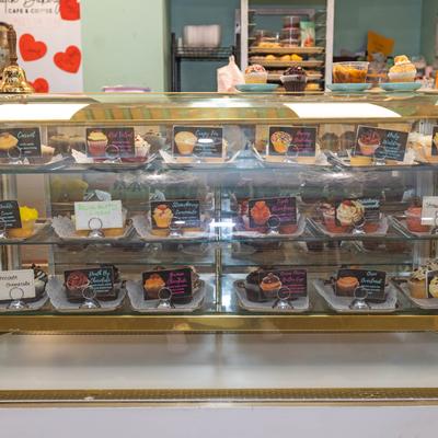 Packed desserts in the refrigerated display case.