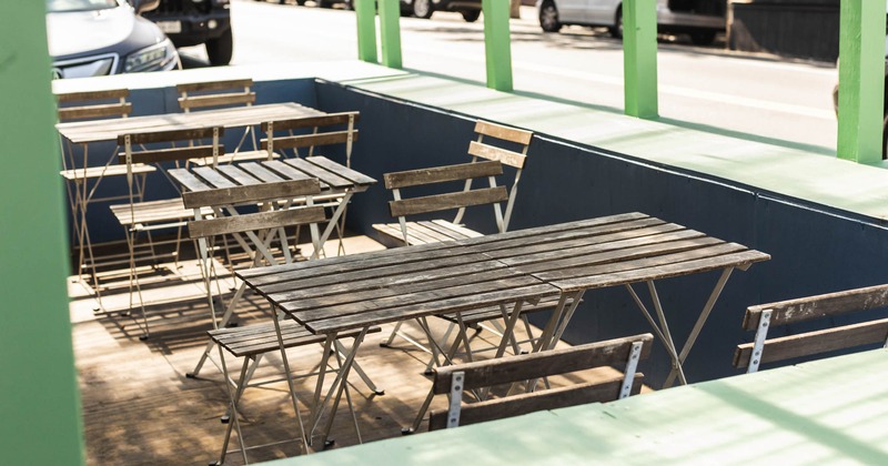 Exterior, seating area with wooden table and chairs