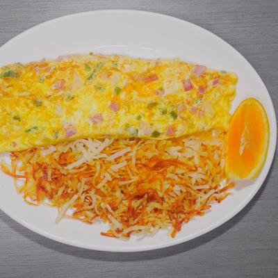 Western Omelet, with ham, peppers, onions, and cheddar cheese, served with hash browns.