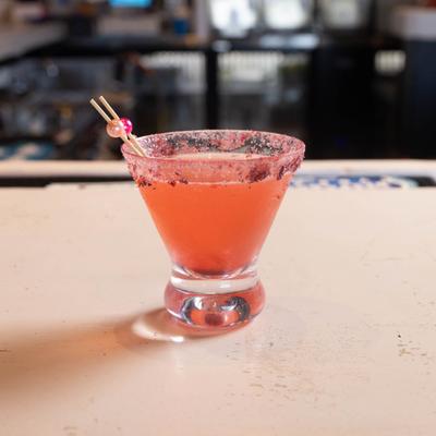 Pink Pearl Martini on a bar counter.