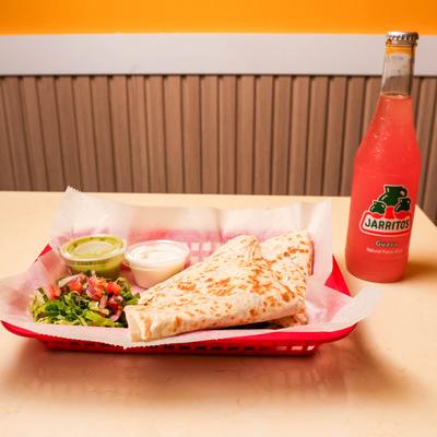 Quesadillas, salsa, dip, and Jarritos soda.