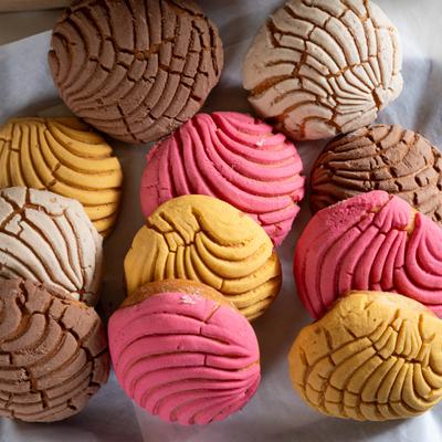 Seashell shaped pastries in various colors.