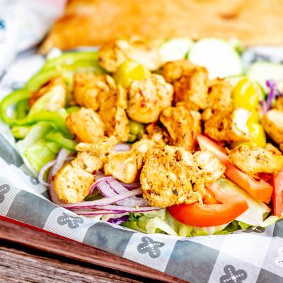 Chicken Kebob Salad served with homemade pita.