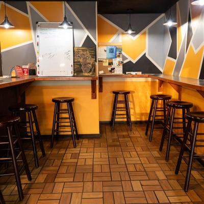 Interior with a counter seatting and stools.