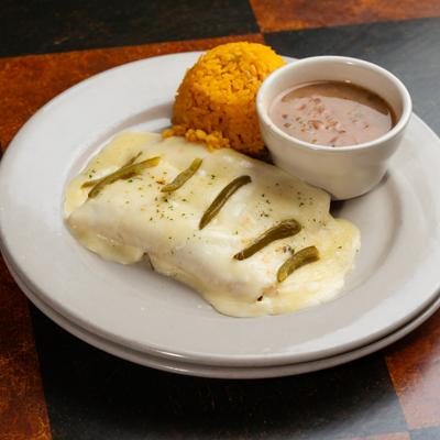 Arturo's Sour Cream Enchiladas served with rice and beans.