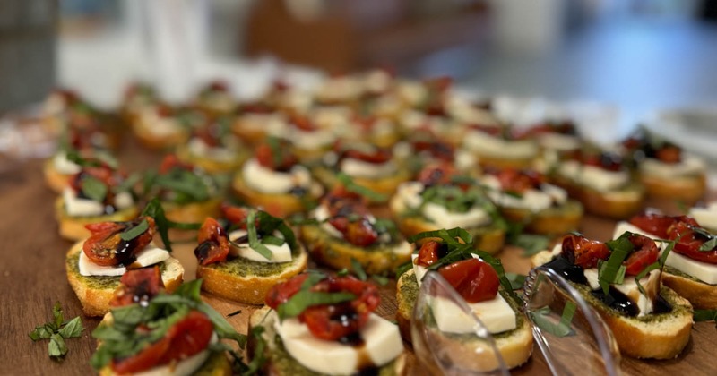 Caprese bruschetta on a wooden board
