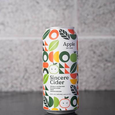 A colorful can of apple dry cider.