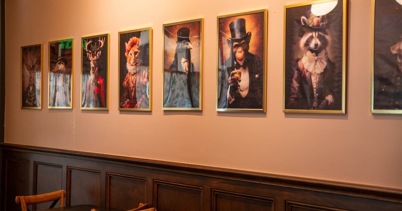 Interior, a wall decorated with framed animal portraits