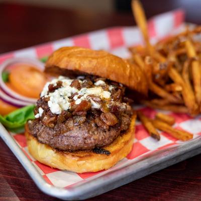 Burger with bacon jam, blue cheese, and fries.