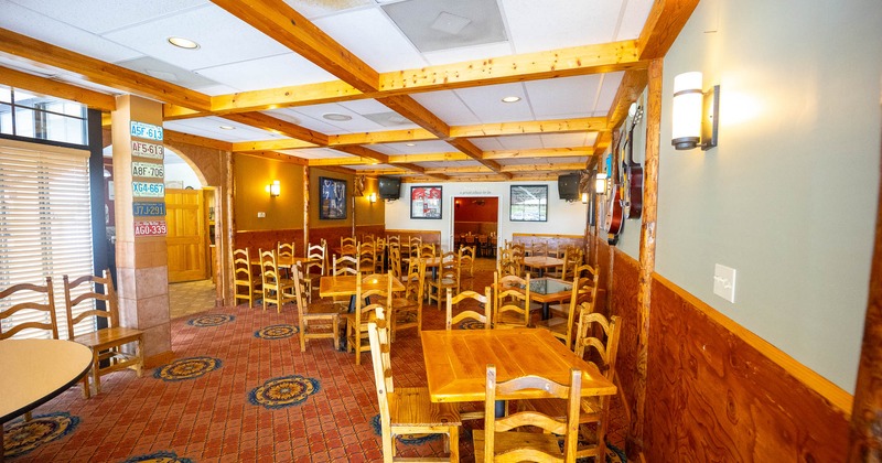 Interior, wooden tables and chairs ready for guests