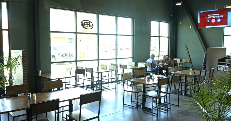 Inteiror, seating area with few guests at the table